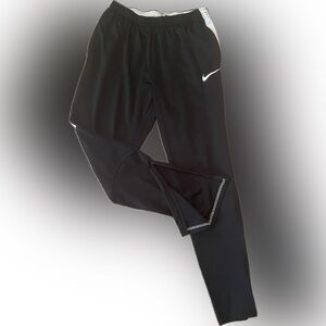 Nike soccer warm up pants with zipper ankles.